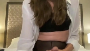 skinny brunette American shemale In darksome pantyhose Strokes Her large penis