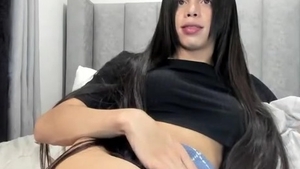 long dark Hair Transgirl Tugs Her massive 10-Pounder On cam